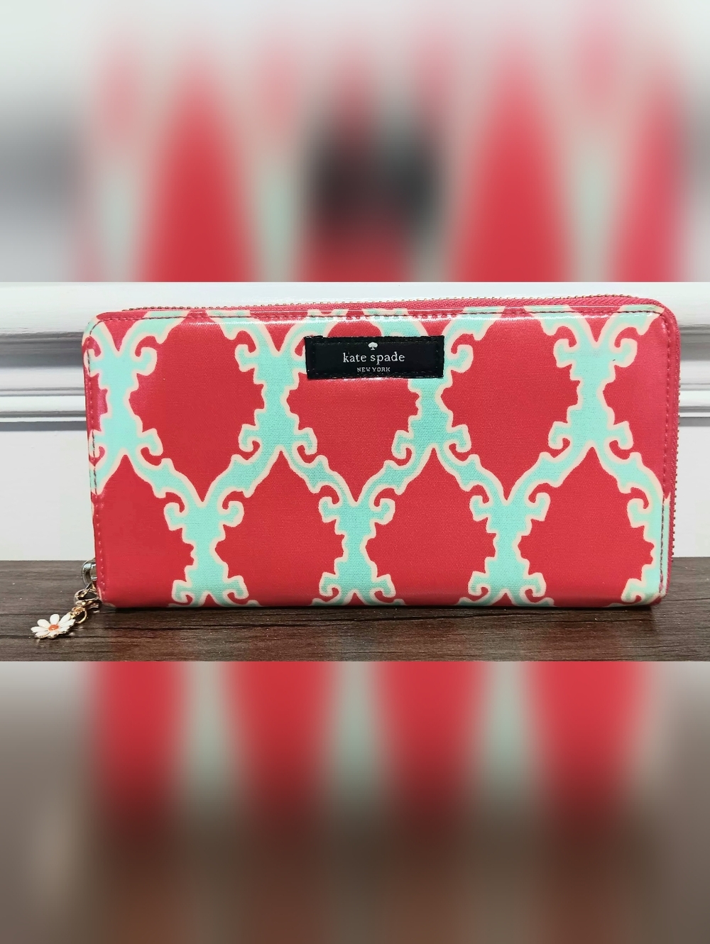 Kate Spade Neda wallet featuring a coral and turquoise trellis print EUC